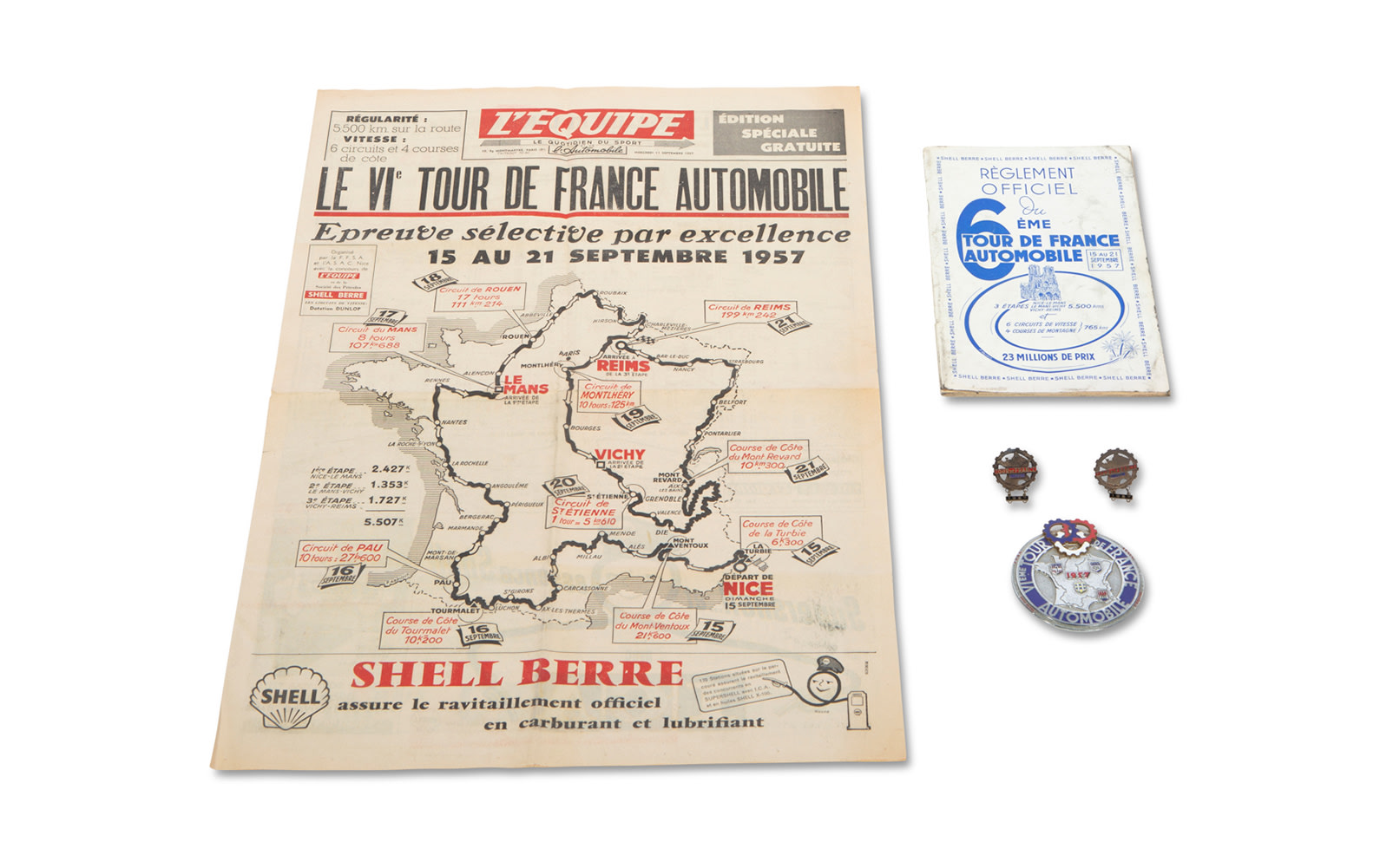 1957 Tour de France Automobile Official Rulebook, Cover of L'Equipe Newspaper, Event Badge, and Two Event Medallions