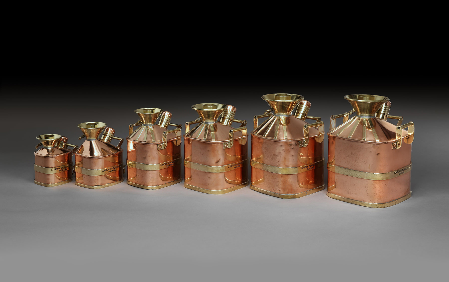 Rare Set of Six Copper and Brass Petrol Measures, c. 1920s