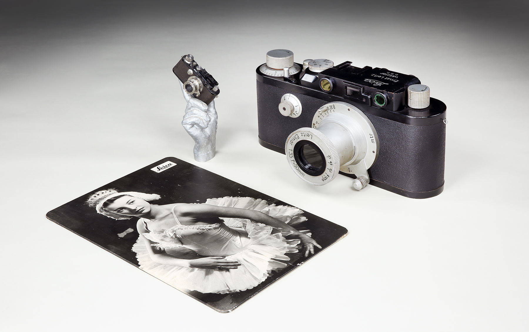 Large Leica III Dummy Display Camera, Leica III Camera in Hand Display, and Leica Publicity Card, 1933